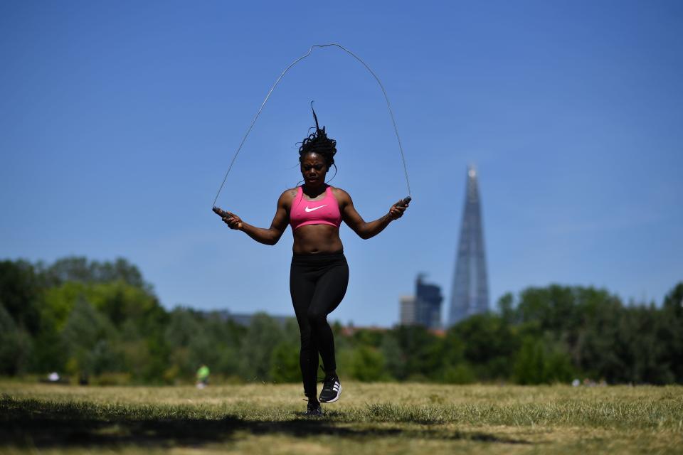 People exercise in Burgess Park in south London on May 29, 2020. (Photo by Ben STANSALL / AFP) (Photo by BEN STANSALL/AFP via Getty Images)