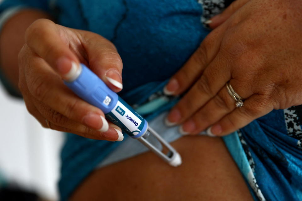 Kim Gradwell with an Ozempic injection needle at her home in Dudley, North Tyneside, Britain, October 31, 2023. Gradwell, a retired receptionist with type 2 diabetes, was not able to get her prescription for Ozempic filled in July through the country’s public health system amid shortages of the medicine that is in high demand from people without diabetes seeking it for its weight-loss effect. REUTERS/Lee Smith