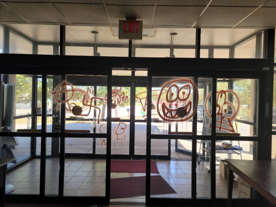 Vandals spray painted the entrance doors to the Dialogue Institute in Kansas City, Kansas, with symbols including a swastika.