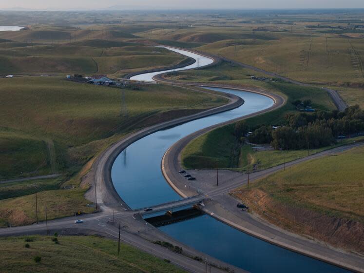 BYRON, CA APRIL 18, 2024 - The California Aqueduct meanders its path from north to south, lower, on Thursday, April 18, 2024 in Byron, Calif. (Paul Kuroda / For The Times)