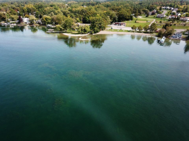 An aerial view of the east side of Canandaigua Lake at Deep Run Cove is seen with evidence of blue green algae during a bloom in 2017.