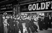 <b>Goldfinger – 1964</b><br><br> Police have to keep the crowds at bay at during the film premiere of ‘Goldfinger’ at the Odeon in Leicester Square. <br><br> (Copyright: REX)