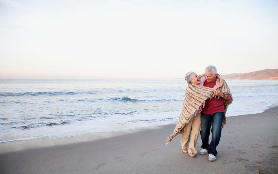 Old couple on beach - Credit: getty creative