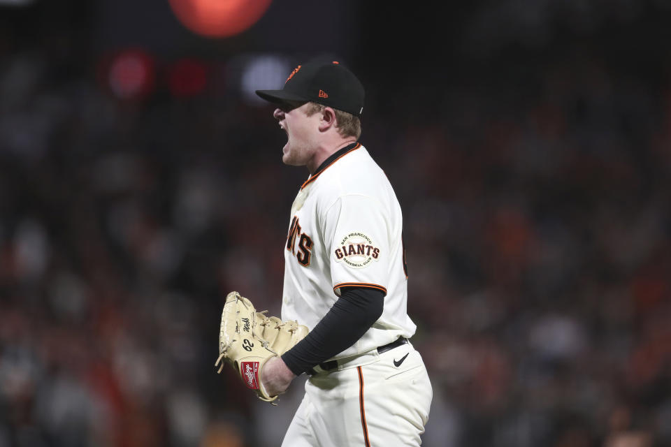 San Francisco Giants pitcher Logan Webb celebrates after striking out Los Angeles Dodgers' Cody Bellinger during the seventh inning of Game 5 of a baseball National League Division Series Thursday, Oct. 14, 2021, in San Francisco. (AP Photo/Jed Jacobsohn)