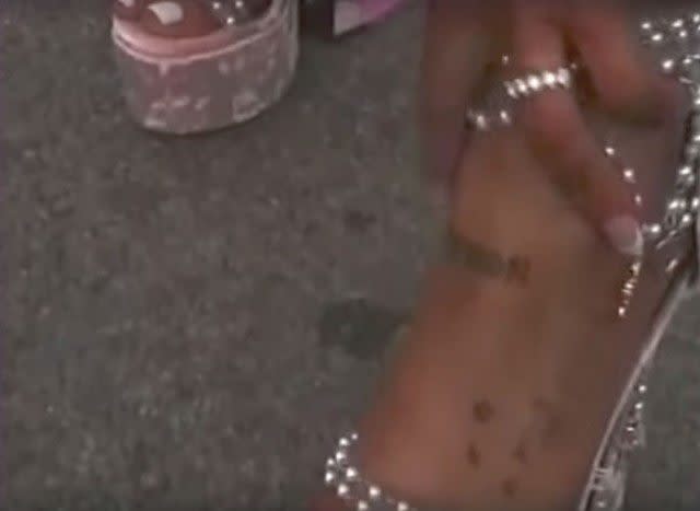The pop star used to have the badge number of her ex-fiance’s father inked on her ankle.