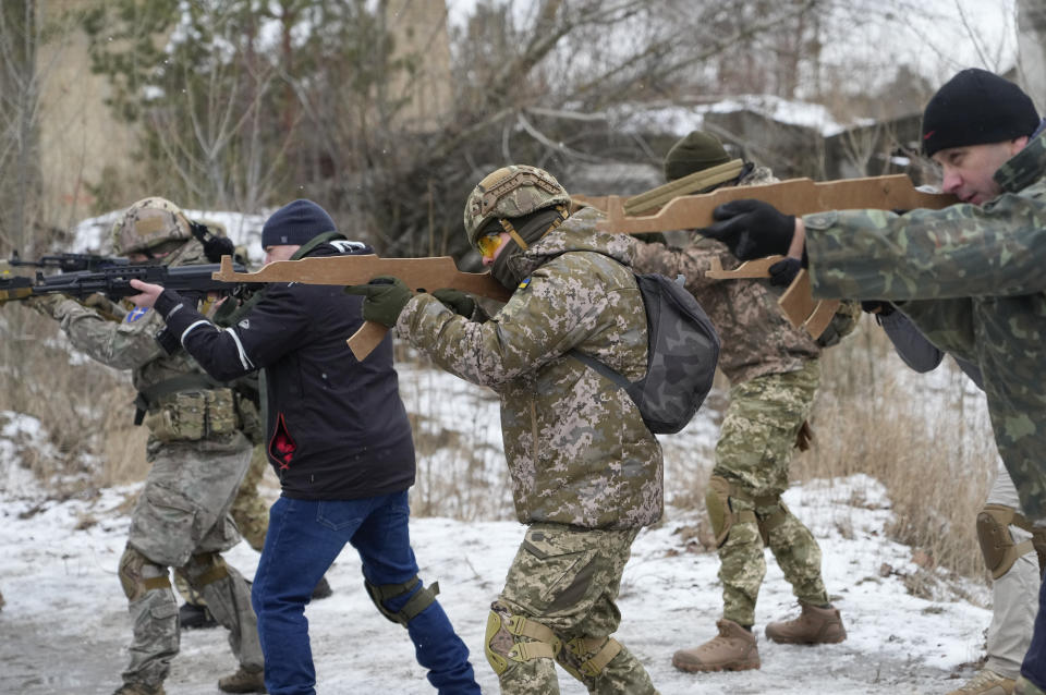 Members of Ukraine's Territorial Defense Forces, volunteer military units of the Armed Forces, train close to Kyiv, Ukraine, Saturday, Jan. 29, 2022. Dozens of civilians have been joining Ukraine's army reserves in recent weeks amid fears about Russian invasion. (AP Photo/Efrem Lukatsky)