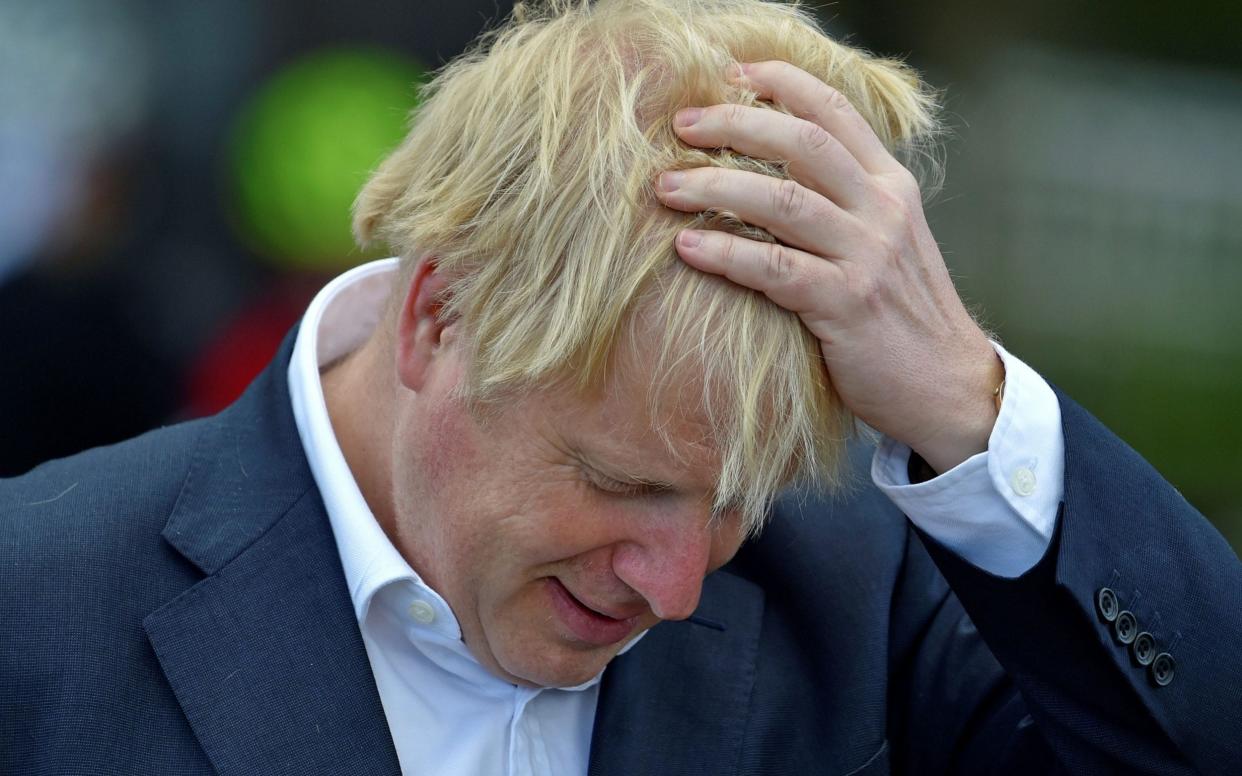 Boris Johnson has had to break promises on care home testing and face masks - GETTY IMAGES