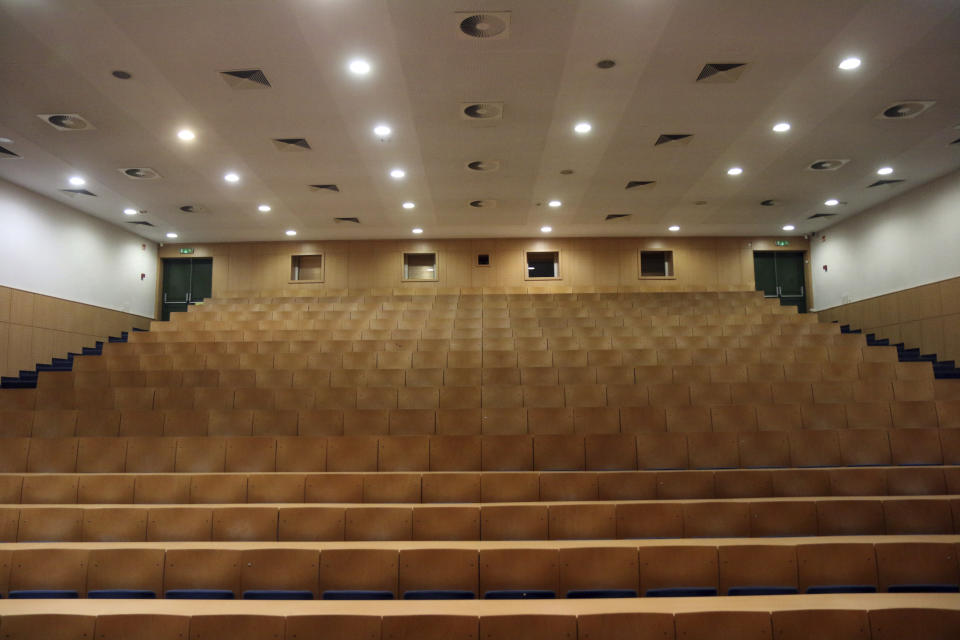 An empty lecture hall at the University of Miskolc in Hungary, Thursday, March 12, 2020, following the Hungarian government declaration of a national state of emergency. (Janos Vajda/MTI via AP)