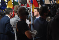 France's European Affairs Minister Clement Beune, right, speaks with the media as he arrives for a meeting of EU General Affairs ministers at the European Council building in Brussels, Tuesday, Sept. 21, 2021. European Union General Affairs ministers meet Tuesday to discuss the state of play in UK-EU relations and a submarine deal between the U.S., Britain and Australia, which led to France losing a contract to sell subs to Australia. (AP Photo/Geert Vanden Wijngaert)