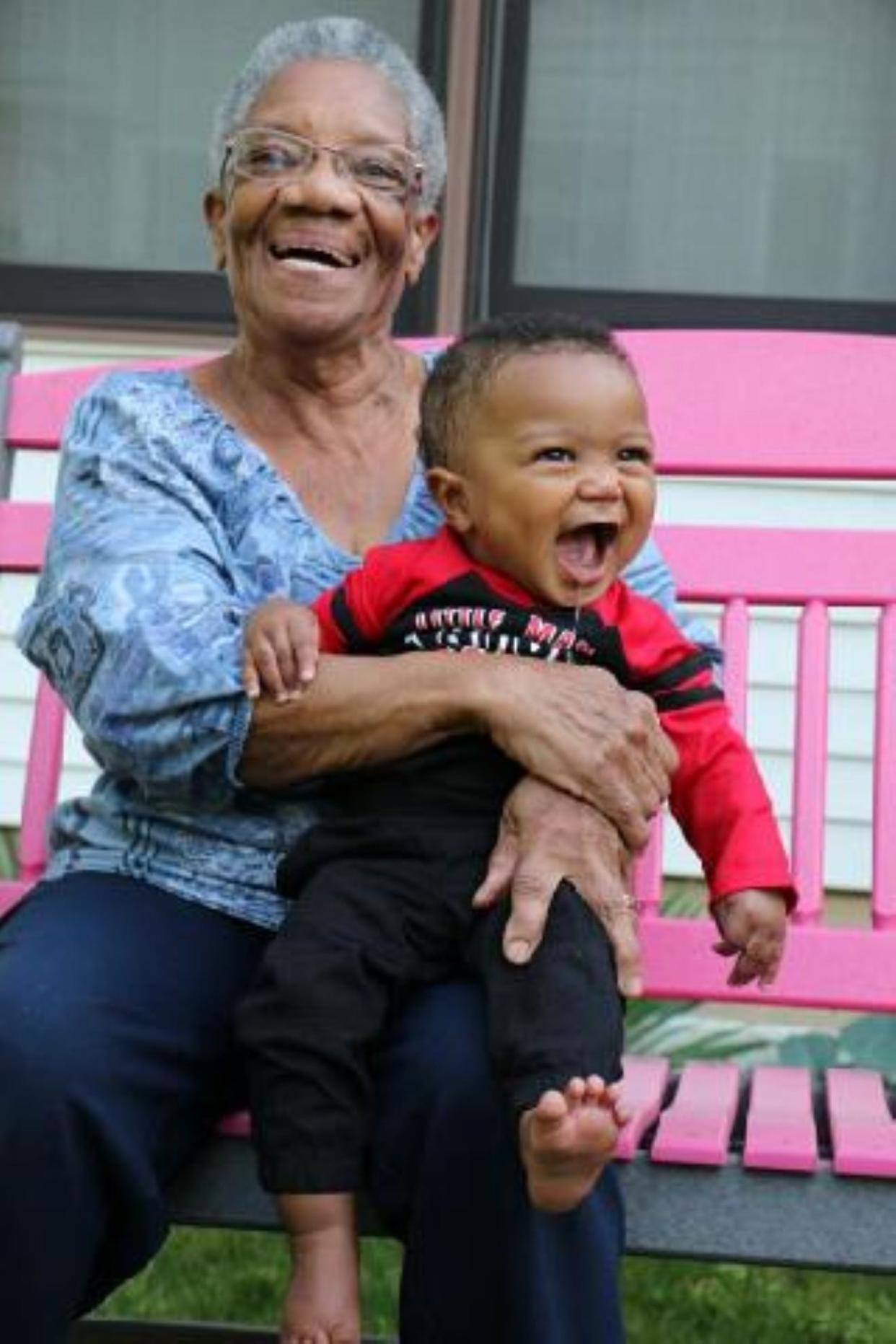 Cordelia Taylor, founder of Family House, a residential facility for seniors to live with dignity and respect, is shown with her grandson Isaiah Jackson.