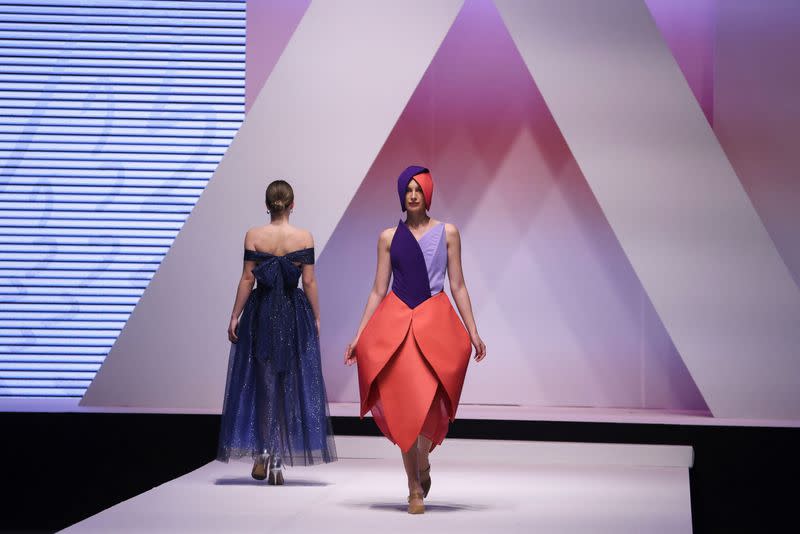 Dresses based on drawings of a victim of Serbia's school shooting are presented during a Fashion Week in Belgrade