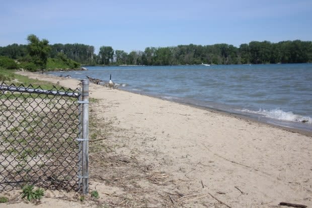 Sand shown past the fence is an area of Sandpoint Beach where it's recommended not to swim.