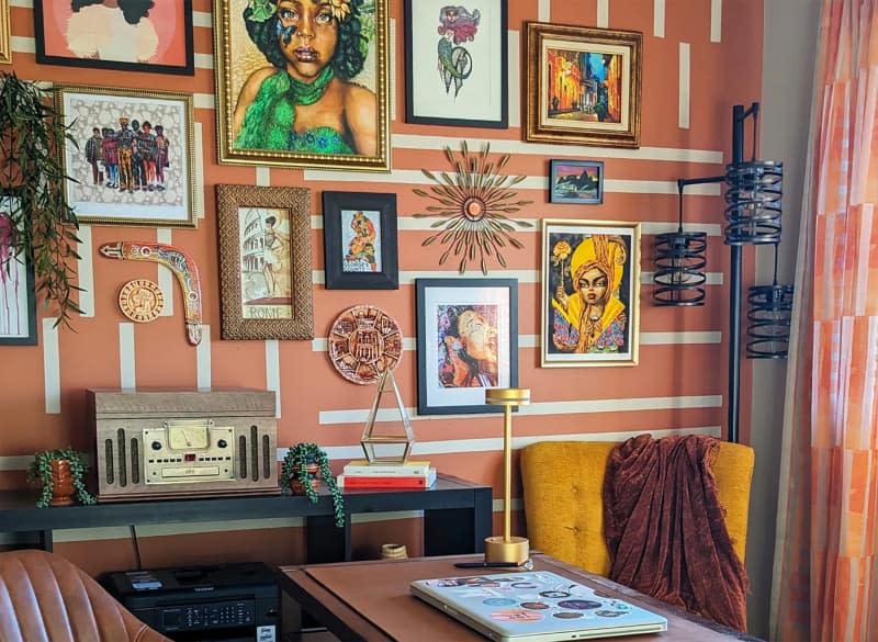 Colorful art wall in dining room.