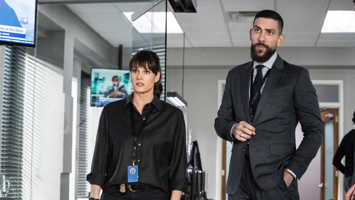  Missy Peregrym as Special Agent Maggie Bell and Zeeko Zaki as Special Agent Omar Adom ‘OA’ Zidan standing next to each other in FBI season 6. 