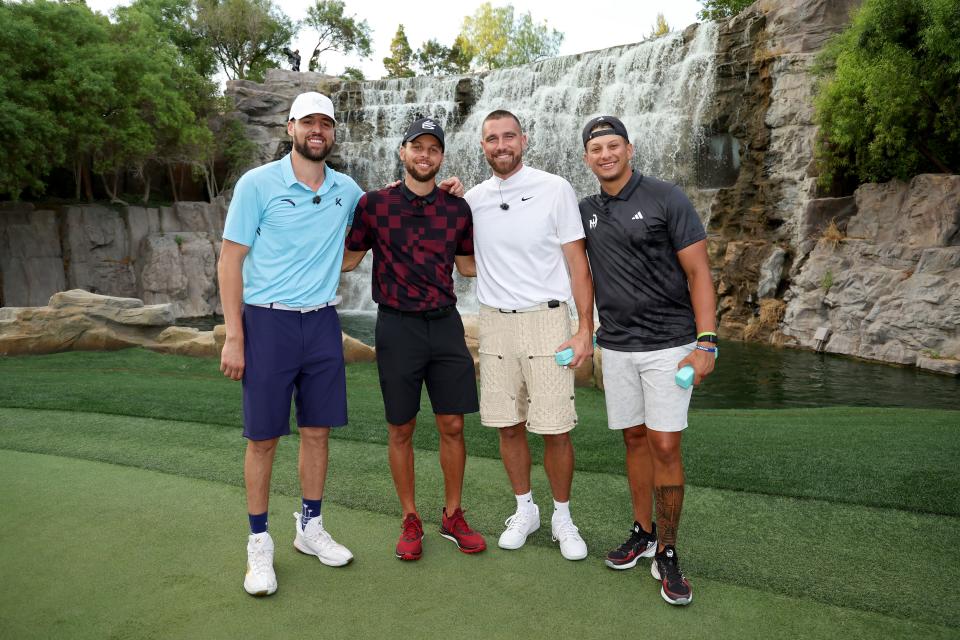 Klay Thompson, Stephen Curry, Travis Kelce and Patrick Mahomes pose for photos after Capital One's The Match VIII at Wynn Golf Club in Las Vegas. (Ezra Shaw/Getty Images for The Match)