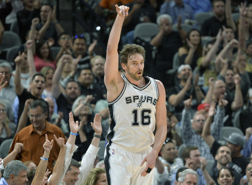 FILE - In this Monday, March 27, 2017, file photo, San Antonio Spurs center Pau Gasol, of Spain, celebrates a 3-point basket during the first half of an NBA basketball game against the Cleveland Cavaliers in San Antonio. In his first season in San Antonio, Gasol has proven to be just what the Spurs needed to help make up for Tim Duncan's retirement. (AP Photo/Darren Abate, File)