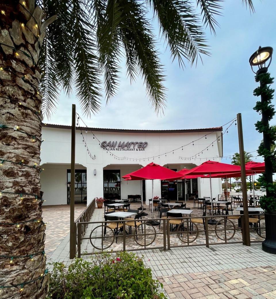 Umbrella-covered tables fill the patio at San Matteo.