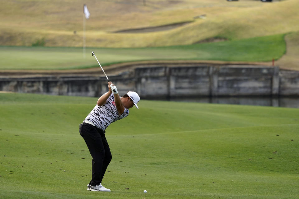 Sungjae Im hits from the seventh fairway during the second round of The American Express golf tournament on the Pete Dye Stadium Course at PGA West on Friday, Jan. 22, 2021, in La Quinta, Calif. (AP Photo/Marcio Jose Sanchez)