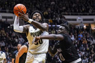 Purdue's Trevion Williams (50) shoots over Omaha's Wanjang Tut (13) during the second half of an NCAA college basketball game in West Lafayette, Ind., Friday, Nov. 26, 2021. Purdue defeated Omaha 97-40. (AP Photo/Michael Conroy)