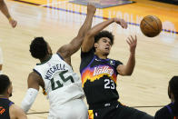 Phoenix Suns forward Cameron Johnson (23) battles Utah Jazz guard Donovan Mitchell (45) for the ball during the second half of an NBA basketball game, Wednesday, April 7, 2021, in Phoenix. (AP Photo/Matt York)