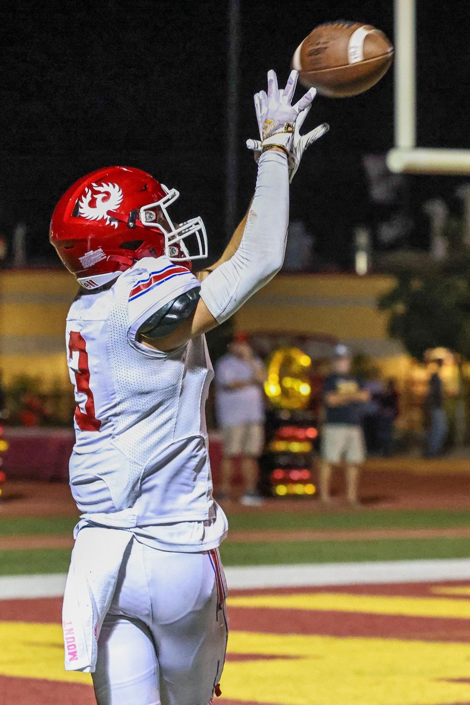 East Union Wide Receiver Blake Mount(3) reels in a deep pass for a touchdown during a game between East Union High and Oakdale High at Oakdale High School in Oakdale, California