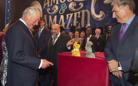 Prince Charles, Prince of Wales meets cast members Omid Djalili, puppets Sooty and Sweep and Jim Carter after attending a one off performance of 'We Are Most Amused and Amazed' in aid of The Prince's Trust - Credit: WPA pool