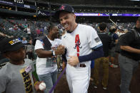 National League's Freddie Freeman, of the Atlanta Braves, laughs with former player Michael Bourn during batting practice prior to the MLB All-Star baseball game, Tuesday, July 13, 2021, in Denver. (AP Photo/David Zalubowski)