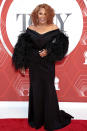 <p>Darlene Love looks glamorous in a black, feathered gown. </p>