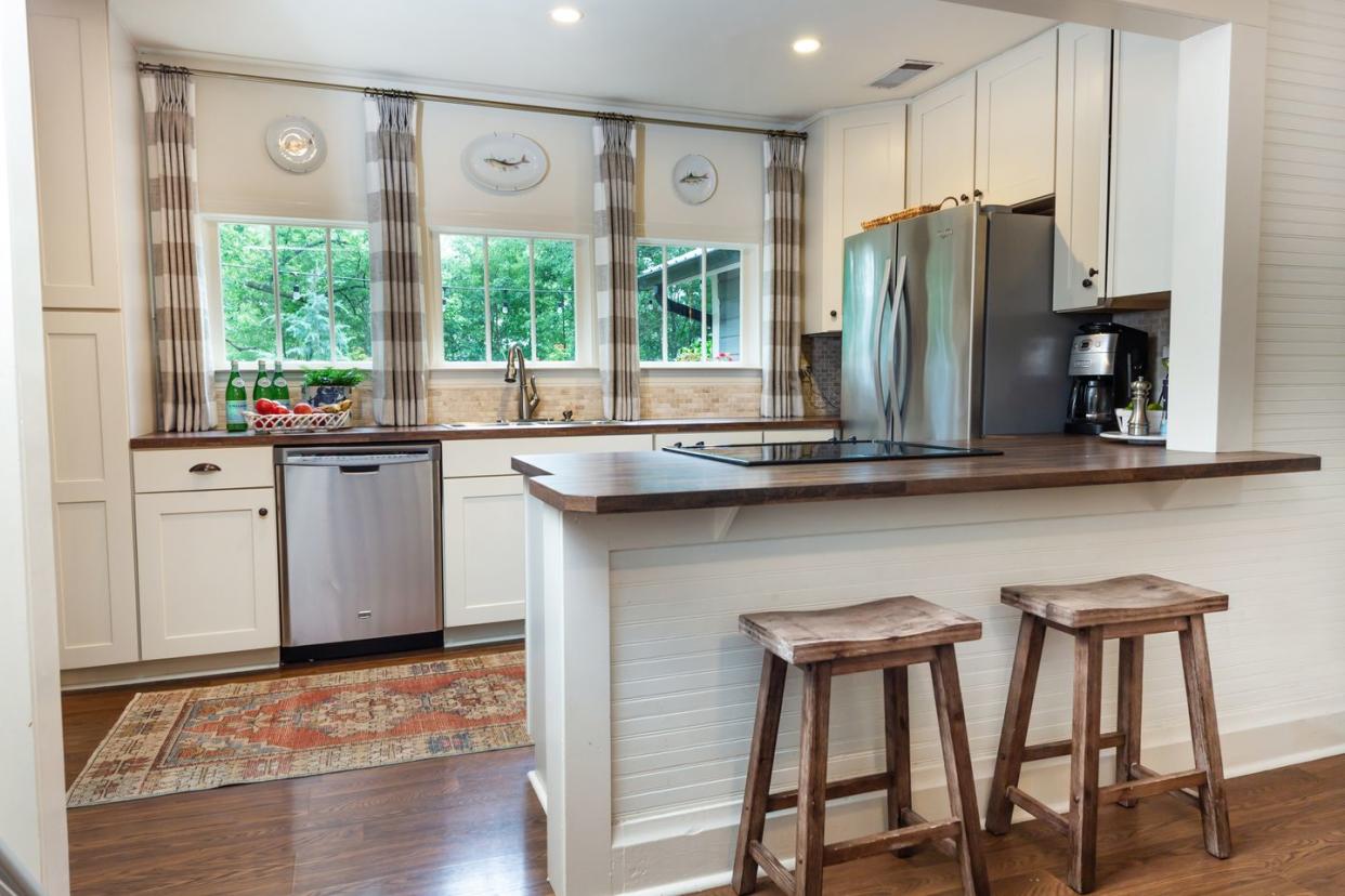 a kitchen with a bar stool