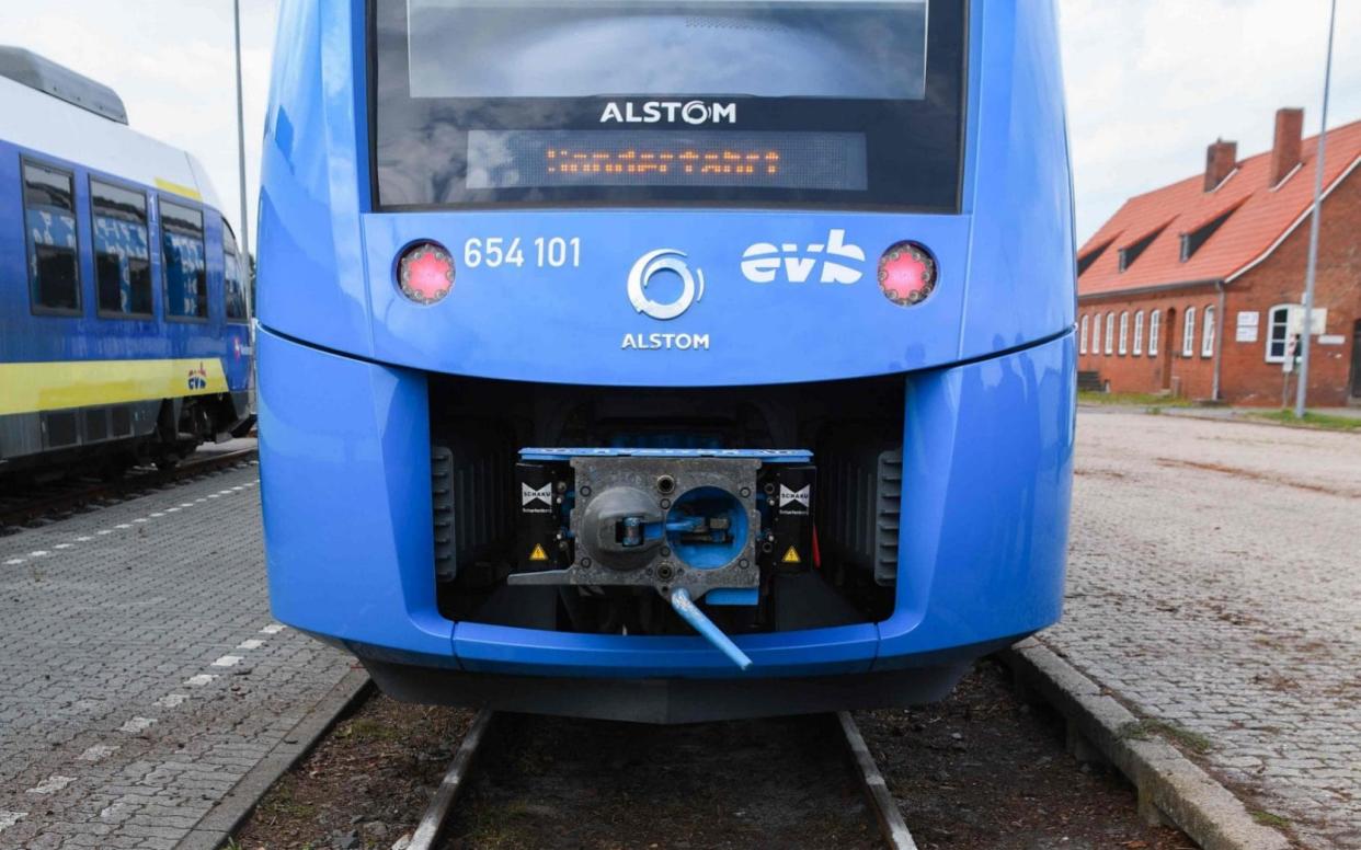 The first hydrogen-powered train, by French train maker Alstom, arrives at the station in Bremervoerde, Germany, as it enters service on September 16, 2018. - Patrik STOLLARZ/AFP/Getty Images