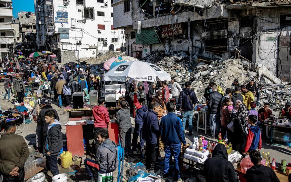 Hawkers are seen selling what little food and basic life necessities they have left on the streets