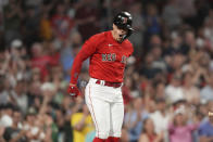 Boston Red Sox's Enrique Hernandez celebrates after his home run as he returns to the dugout in the seventh inning of a baseball game against the Cincinnati Reds, Thursday, June 1, 2023, in Boston. (AP Photo/Steven Senne)