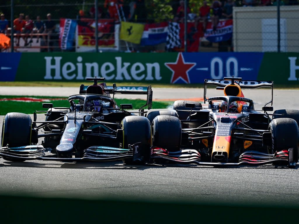 Lewis Hamilton (left) and Max Verstappen crash at the Italian GP (AFP via Getty Images)