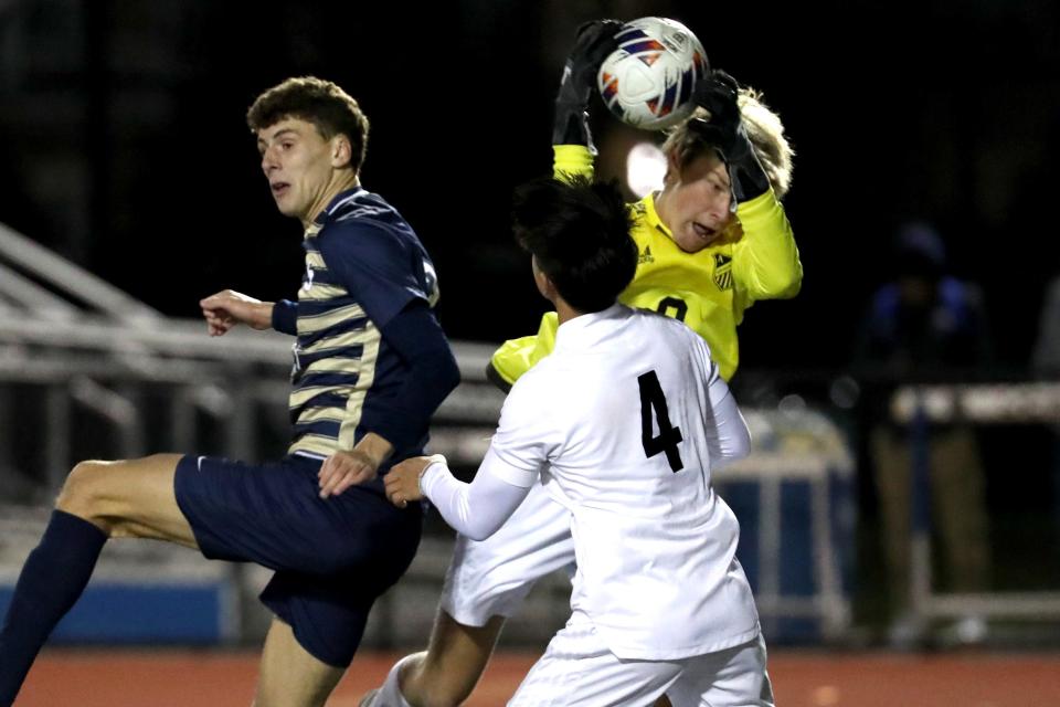 Appoquinimink goalkeeper Riley Buzby (0) stops a shot by Salesianum.