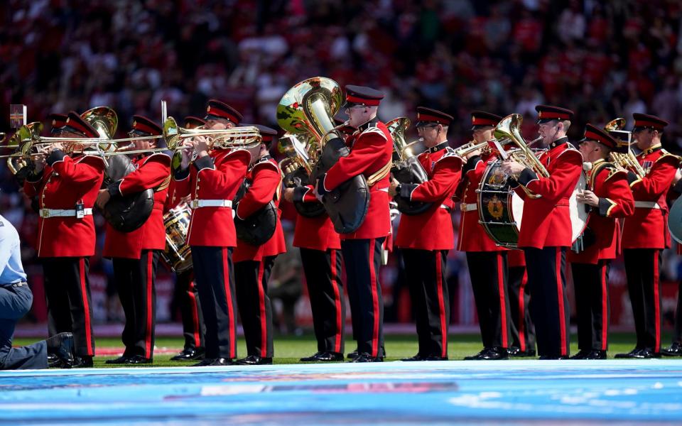 A brass band play on the pitch before the Emirates FA Cup final at Wembley Stadium, - PA/Adam Davy