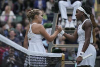 Sofia Kenin of the US, left, shakes hands with Coco Gauff of the US after winning the first round women's singles match on day one of the Wimbledon tennis championships in London, Monday, July 3, 2023. (AP Photo/Alastair Grant)