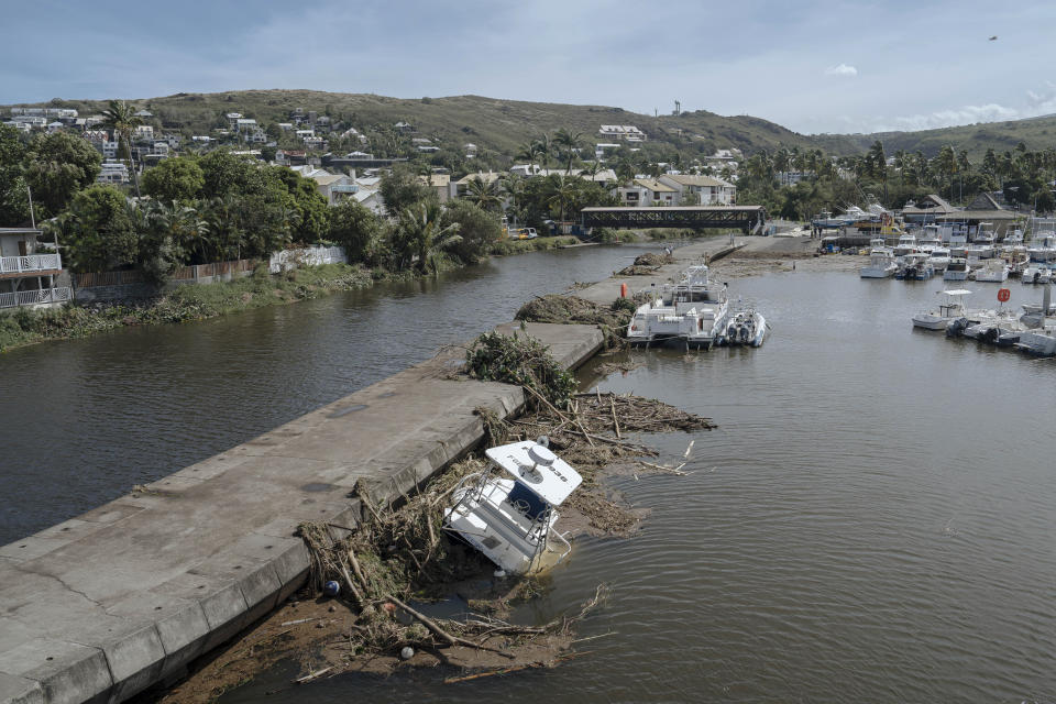 tTrees and debris are seen in the marina of Saint-Gilles les Bains on the French Indian Ocean island of Reunion, Tuesday, Jan. 16, 2024. Tropical cyclone Belal had battered the French island of Reunion, where the intense rains and powerful winds left about a quarter of households without electricity after hitting Monday morning, according to the prefecture of Reunion. (AP Photo/Lewis Joly)