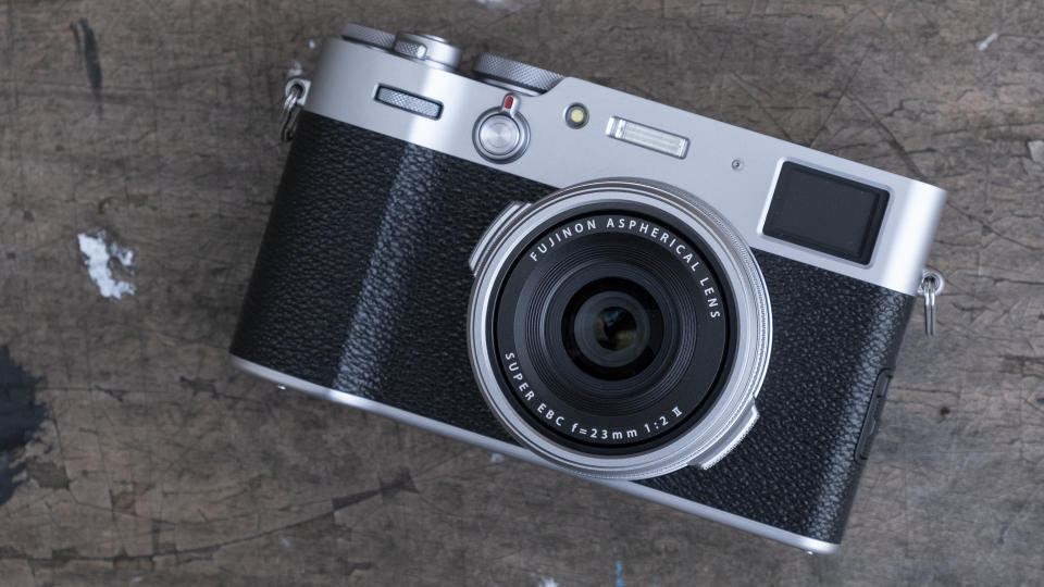 Fujifilm X100V camera on a wooden table