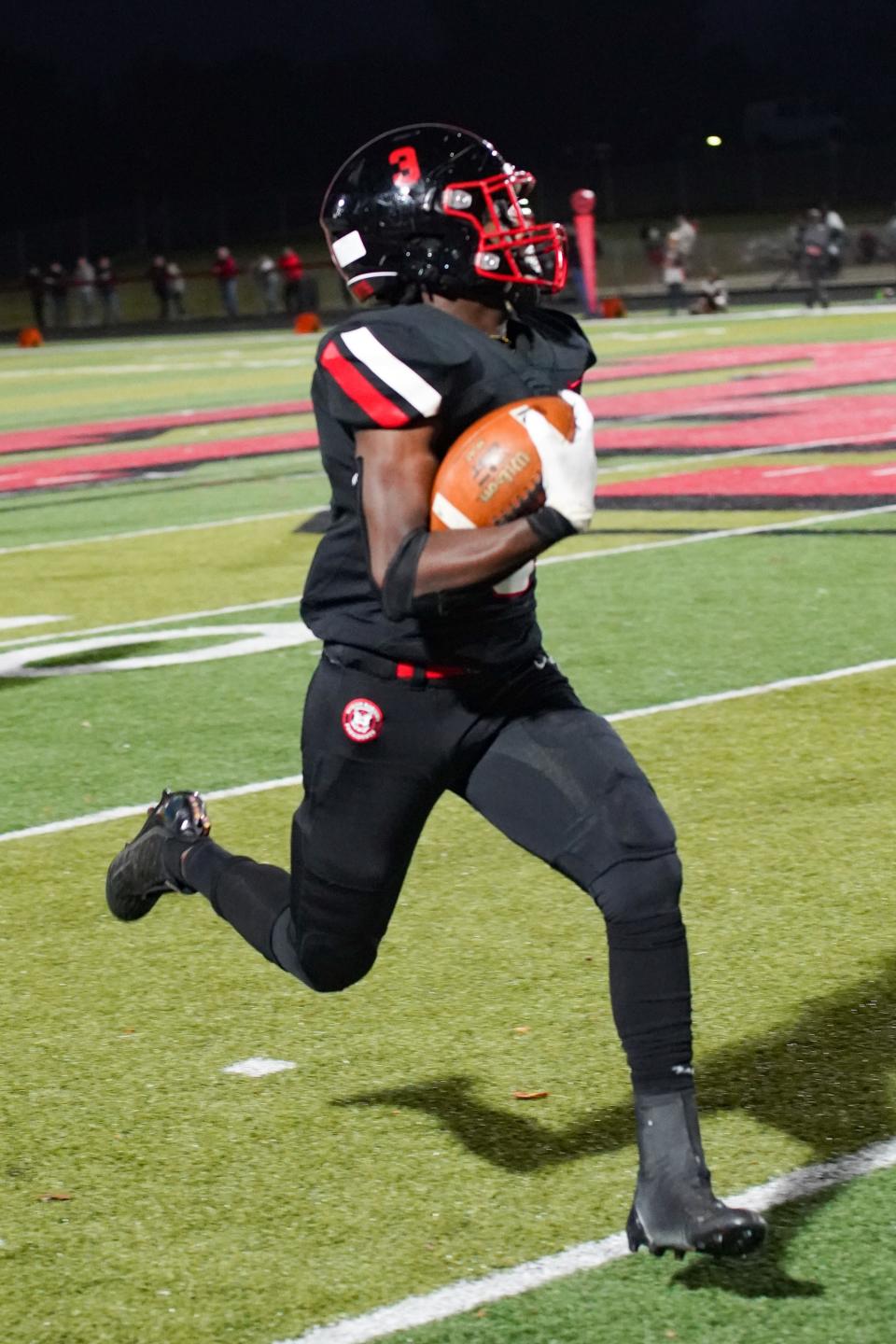 Marion Harding running back Trinity Keith streaks up the home sideline for a long touchdown run during Friday's football game with Pleasant.