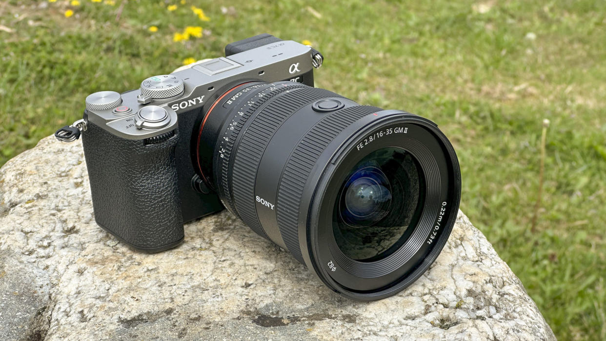  Sony FE 16-35mm F2.8 GM II lens attached to a Sony A7C II, outdoors on a rock. 