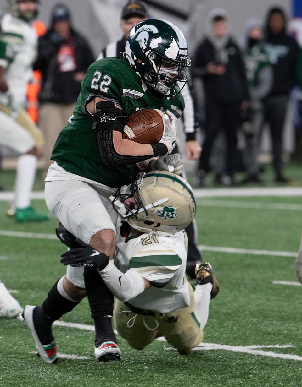 DePaul's Tyler Brown is tackled by Red Bank Catholic's Corbett Cimini in the first half of the NJSIAA Nonpublic B championship game Friday night at MetLife Stadium.