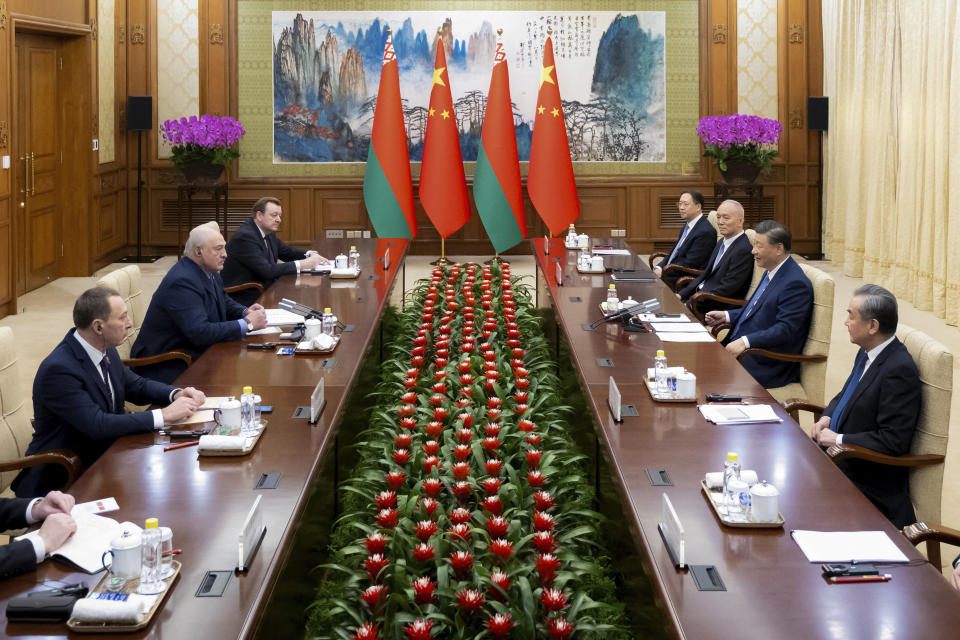 In this photo released by Xinhua News, Chinese President Xi Jinping, second right, talks to his Belarusian counterpart Alexander Lukashenko during the bilateral meeting in Beijing, Monday, Dec. 4, 2023. Chinese leader Xi Jinping spoke of a "strengthened political mutual trust and international coordination" with Belarus after he met with the European country's president in Beijing, according to official media. (Zhai Jianlan/Xinhua via AP)