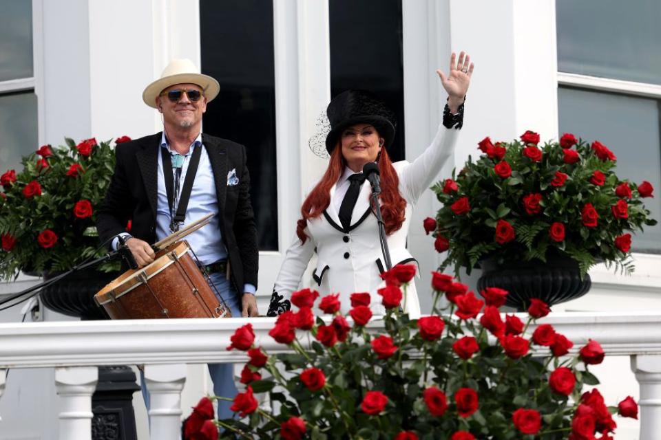 louisville, kentucky may 04 wynonna judd and husband cactus moser wave to the crowd after playing the national anthem before the start of the 150th running of the kentucky derby at churchill downs on may 04, 2024 in louisville, kentucky photo by rob carrgetty images