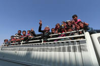<p>Civilians react atop of a pick-up truck after they were evacuated by the Syria Democratic Forces (SDF) fighters from an Islamic State-controlled neighbourhood of Manbij, in Aleppo Governorate, Syria, Aug. 12, 2016. (REUTERS/Rodi Said) </p>