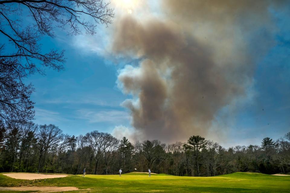 A fire burns west of Route 3 and north of Mail Road in the Liberty section of Exeter.