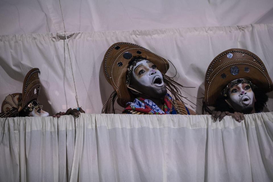 Performers from the Imperatriz Leopoldinense samba school parade on a float during Carnival celebrations at the Sambadrome in Rio de Janeiro, Brazil, Tuesday, Feb. 21, 2023. (AP Photo/Bruna Prado)