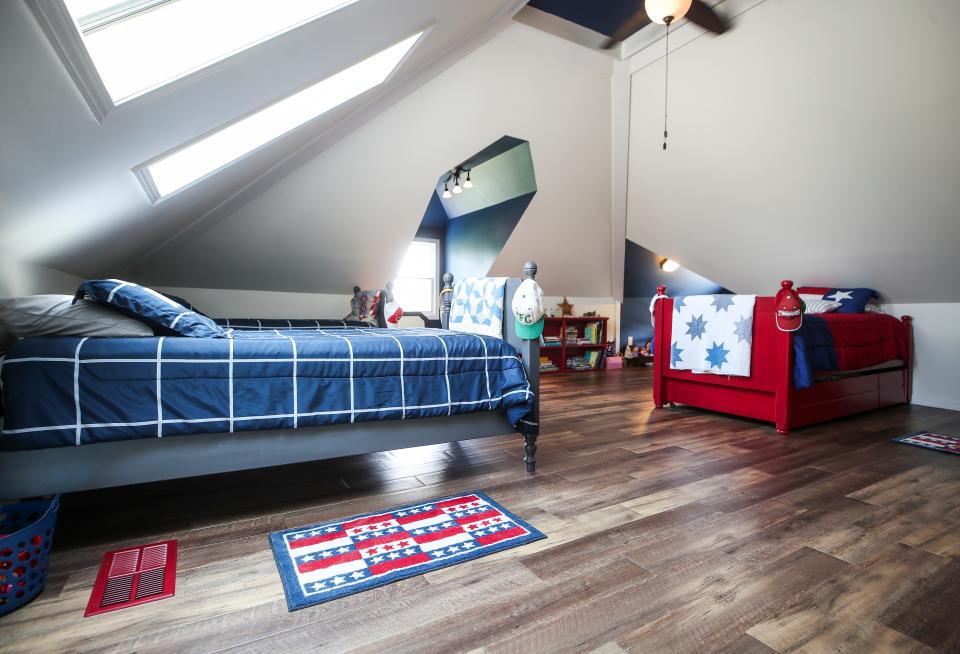 The finished attic of Pam and Rick Gadjen's New Albany home has skylights, wood floor and enough space for beds and play area for grandchildren.
