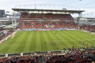 FILE - FC Dallas and Toronto FC players take pitch at the newly renovated BMO Field before the start of an MLS soccer match in Toronto on Saturday, May 7, 2016. There are 23 venues bidding to host soccer matches at the 2026 World Cup in the United States, Mexico and Canada. (Frank Gunn/The Canadian Press via AP, File)