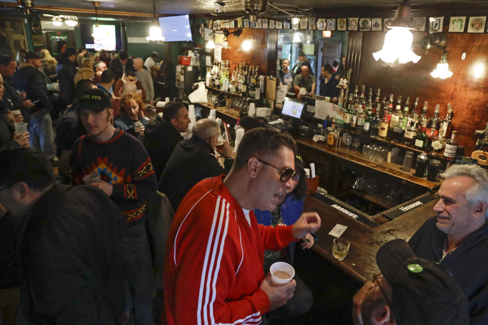 FILE- In this Jan. 11, 2020, file photo, patrons gather at Neir's Tavern in the Queens borough of New York. With New York City at the epicenter of the coronavirus outbreak in the U.S. and its native-born among those offering crucial information to the nation in televised briefings, the New York accent has stepped up to the mic. (AP Photo/Frank Franklin II, File)