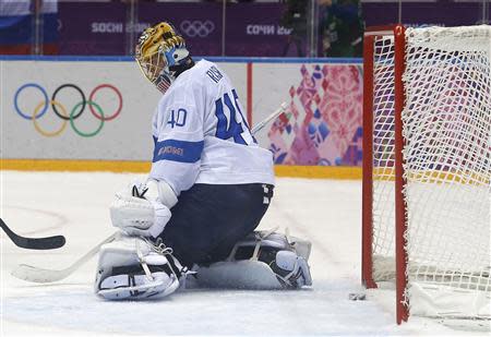 Finland's goalie Tuukka Rask (40) lets in the game-winning overtime goal, scored by Canada's Drew Doughty (not shown), during their men's preliminary round ice hockey game at the Sochi 2014 Sochi Winter Olympics, February 16, 2014. REUTERS/Jim Young